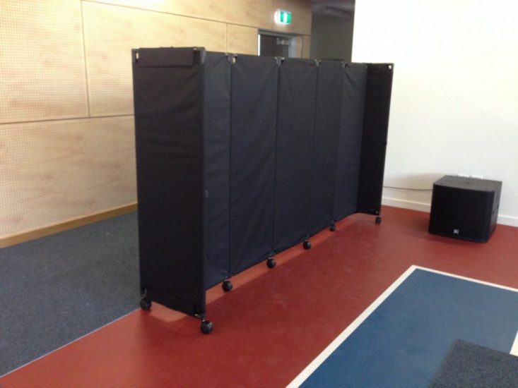 Basic black canvas screen MP10 on edge of school basketball court - Portable Partitions